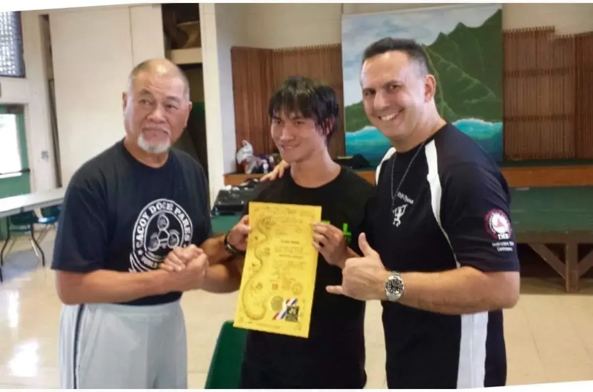 Sijo Nathan Young receiving Danzan Ryu Jujitsu rank under Professor Kai Li of Elite Training Systems